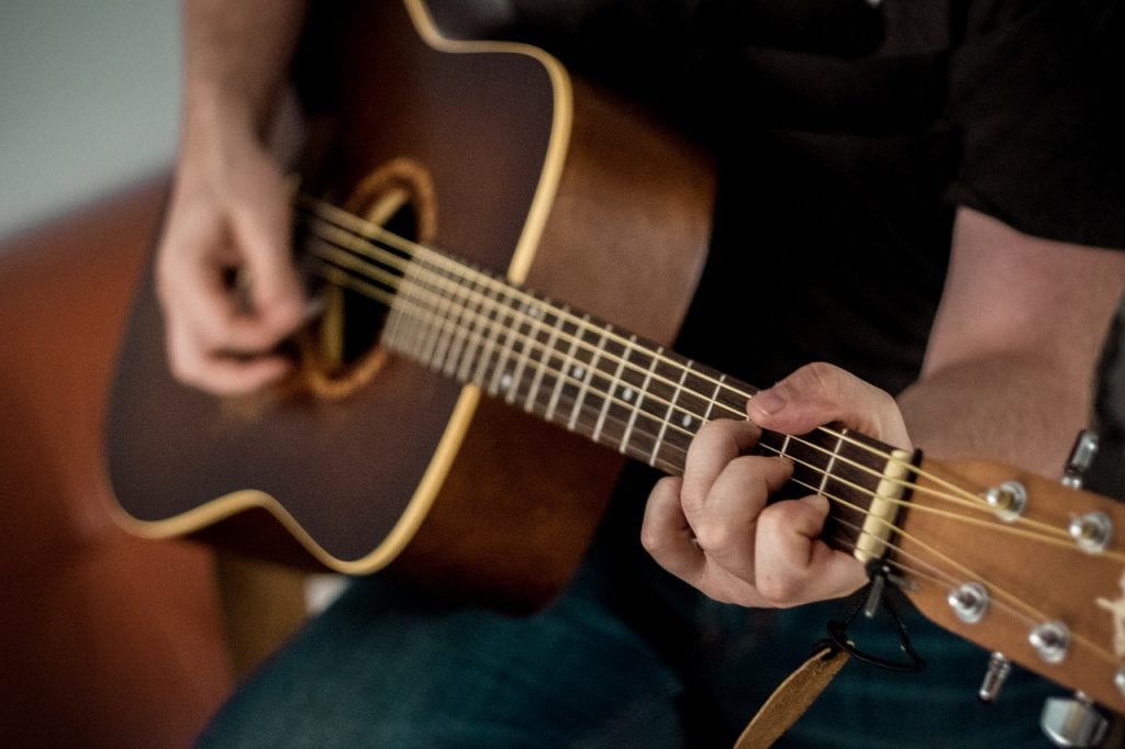 a person playing the guitar