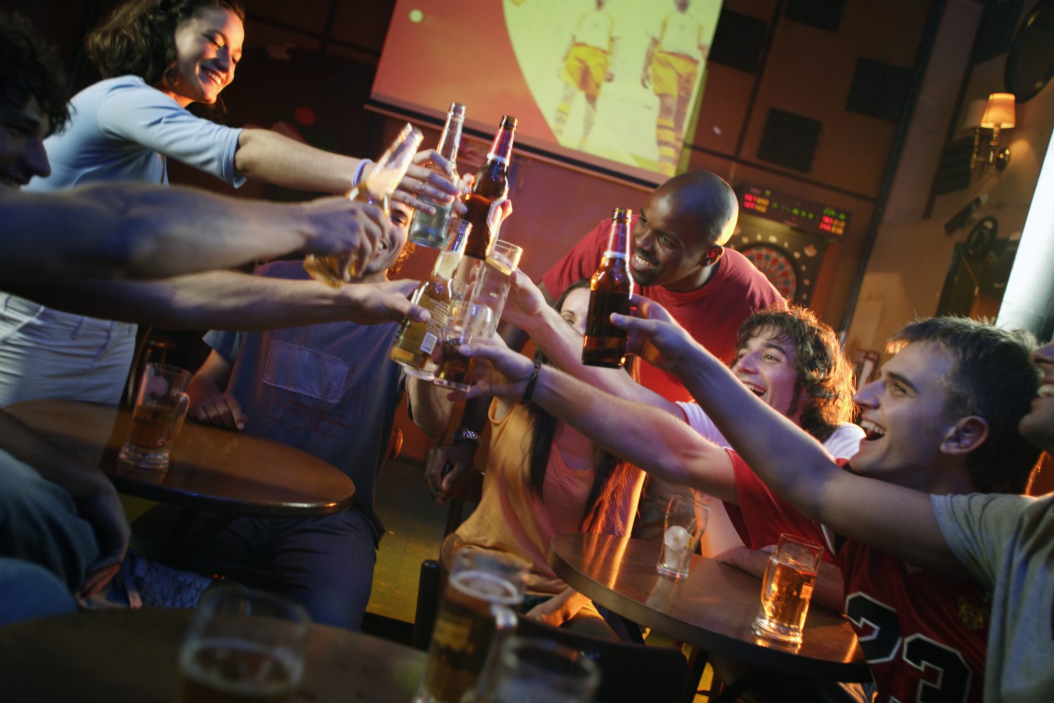 friends toasting at sports bar