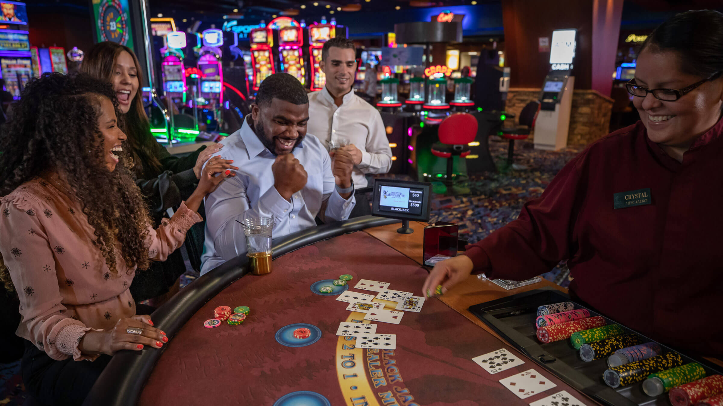 People playing blackjack at the Inn of the Mountain Gods Casino.