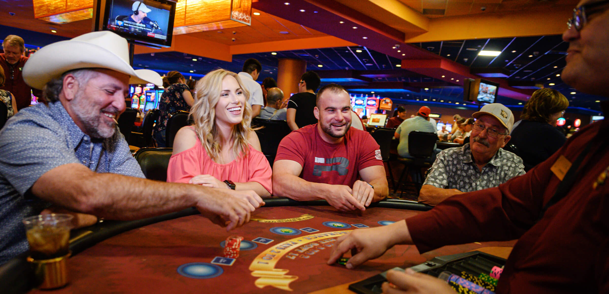 Players playing a card table game at Inn of the Mountain Gods Casino.