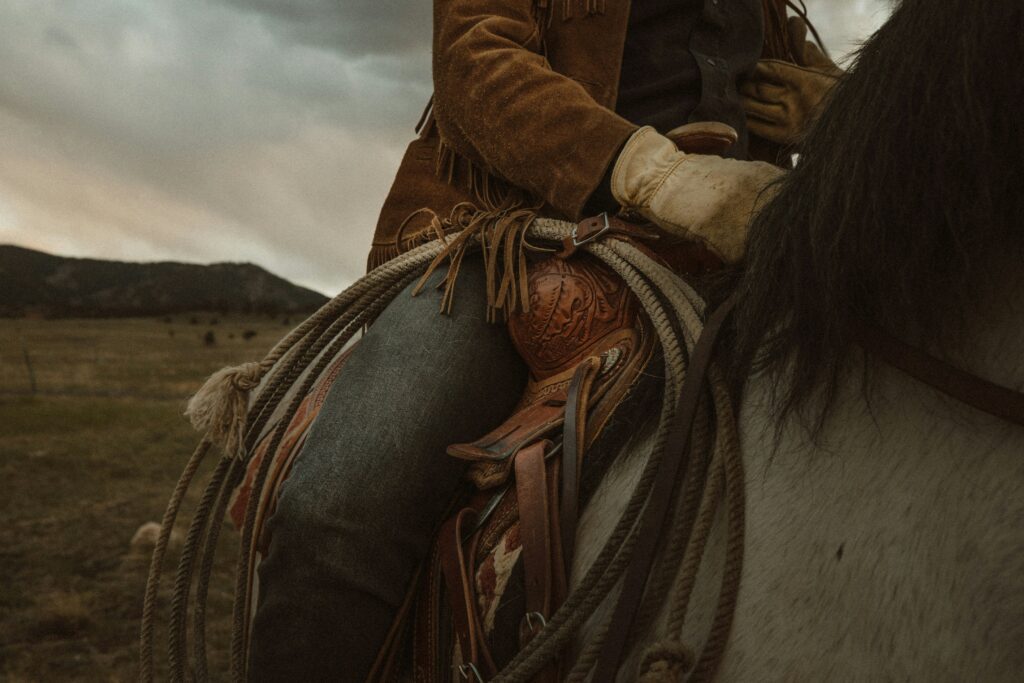 Close up of a cowboy on horseback.